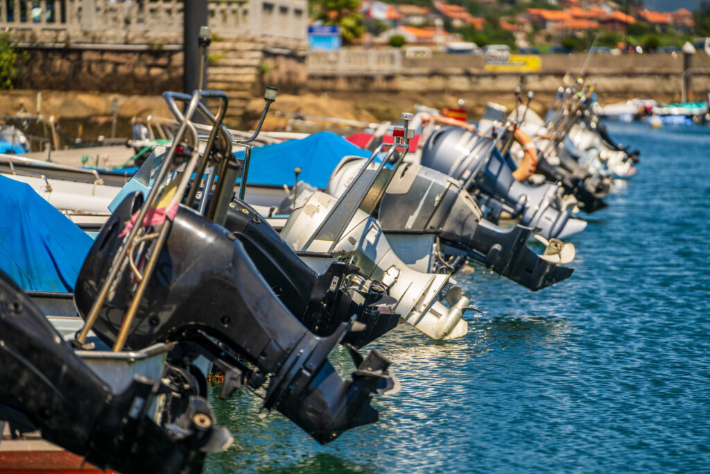 Boats with various sized engines on waterfront of Cape Town South Africa