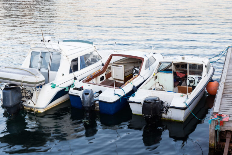 A variety of 3 new and used boats docked along side each other in South Africa