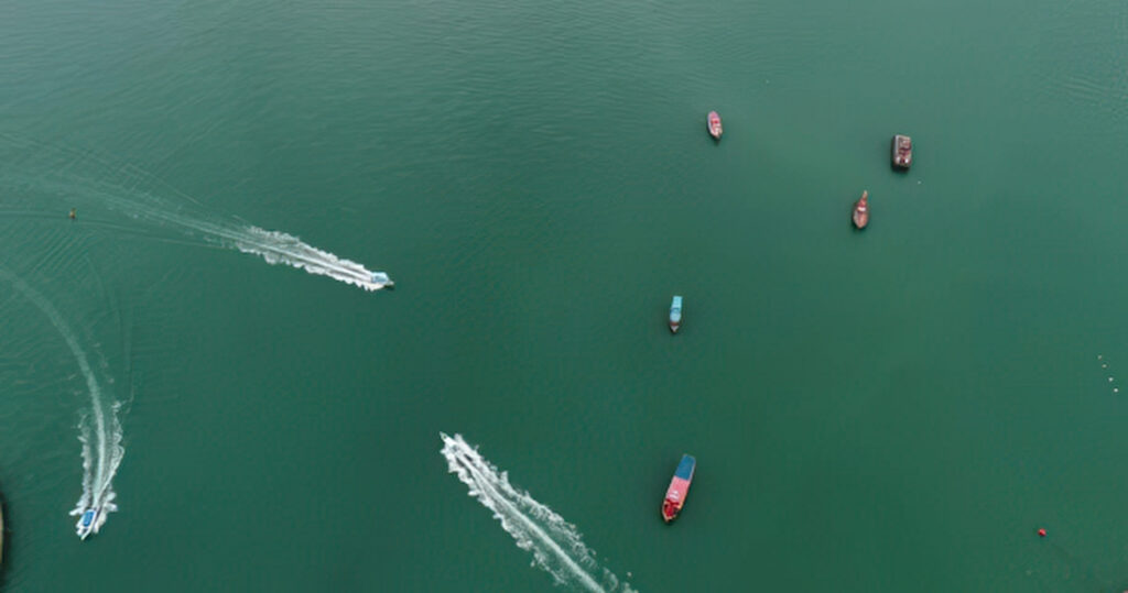 Aerial view of fishing and Ski boats in the sea. Top view from drone